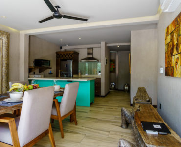 luxury real estate in aldea zama tulum art house dining to kitchen