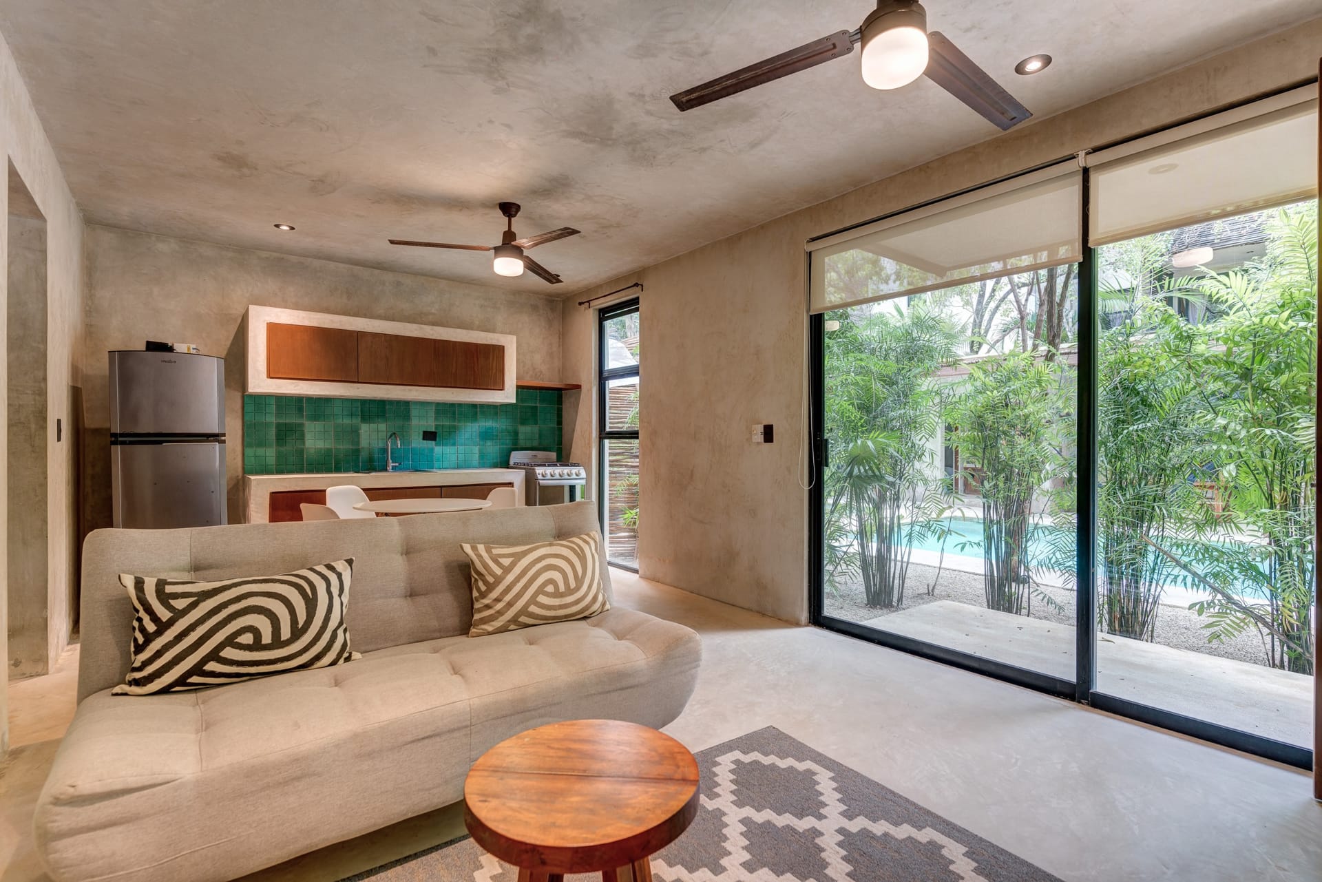 one bedroom ground floor condo tulum real estate sukha112 la veleta kitchen and living with terrace