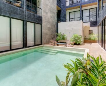 condo for sale in playa del carmen musa del carmen pool with plants