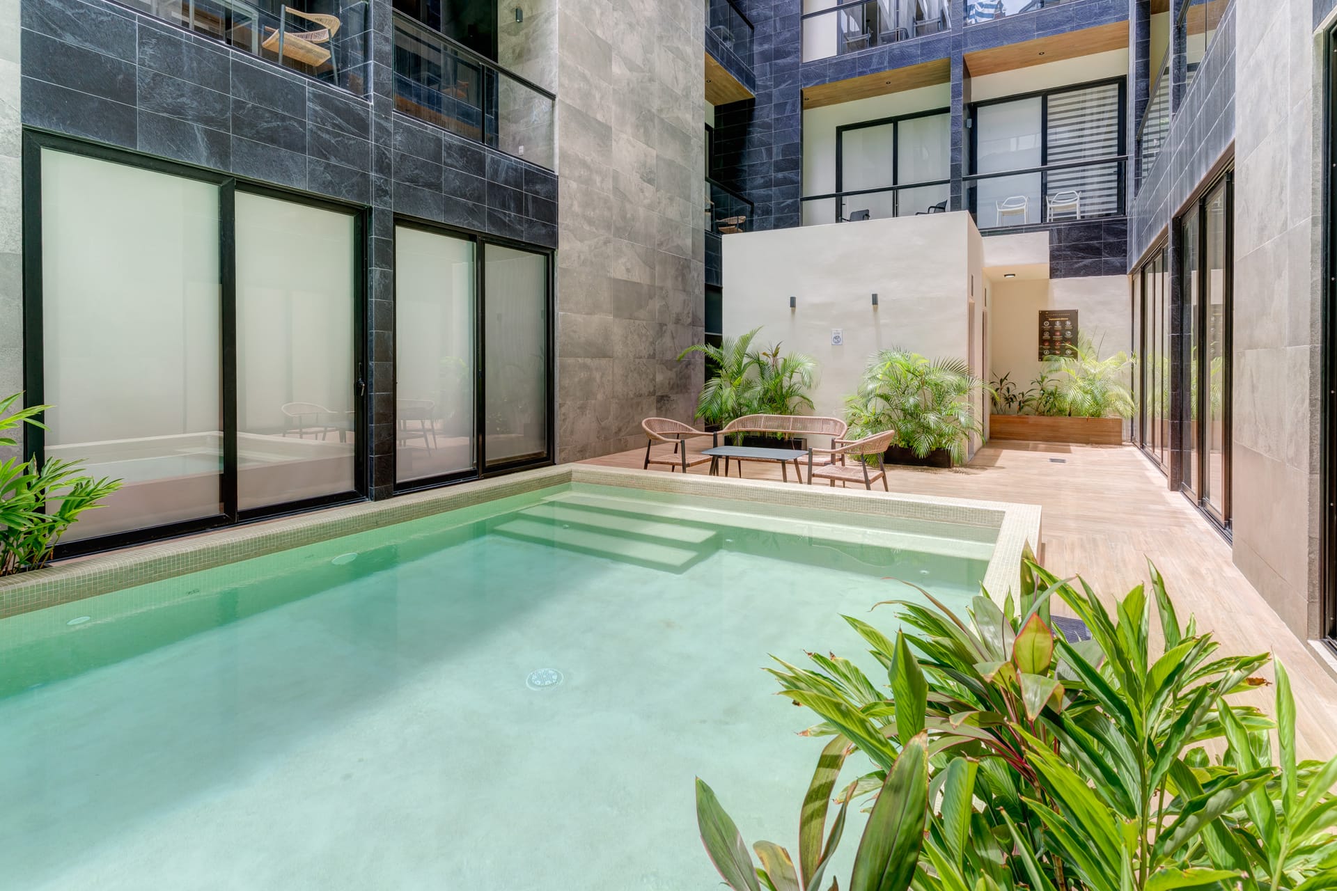 condo for sale in playa del carmen musa del carmen pool with plants