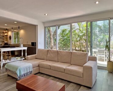 condo for sale in playacar vaiven del viento family estancia viendo hacia la terraza exterior