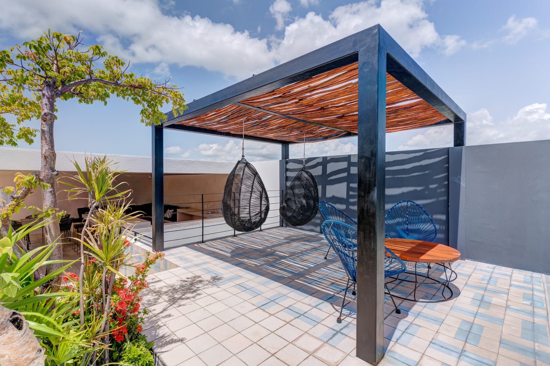 two bedroom condo riva playa del carmen suspended chairs in lounge area