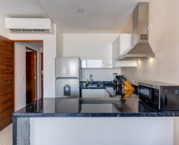 playa del carmen condos for sale 2 bedroom condo tzalam kitchen front view