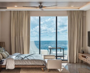 real estate in puerto morelos soulam master bedroom with ocean view and tv
