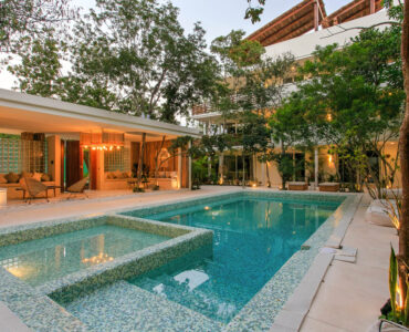 v condos for sale in tulum carmela pool and lounge night