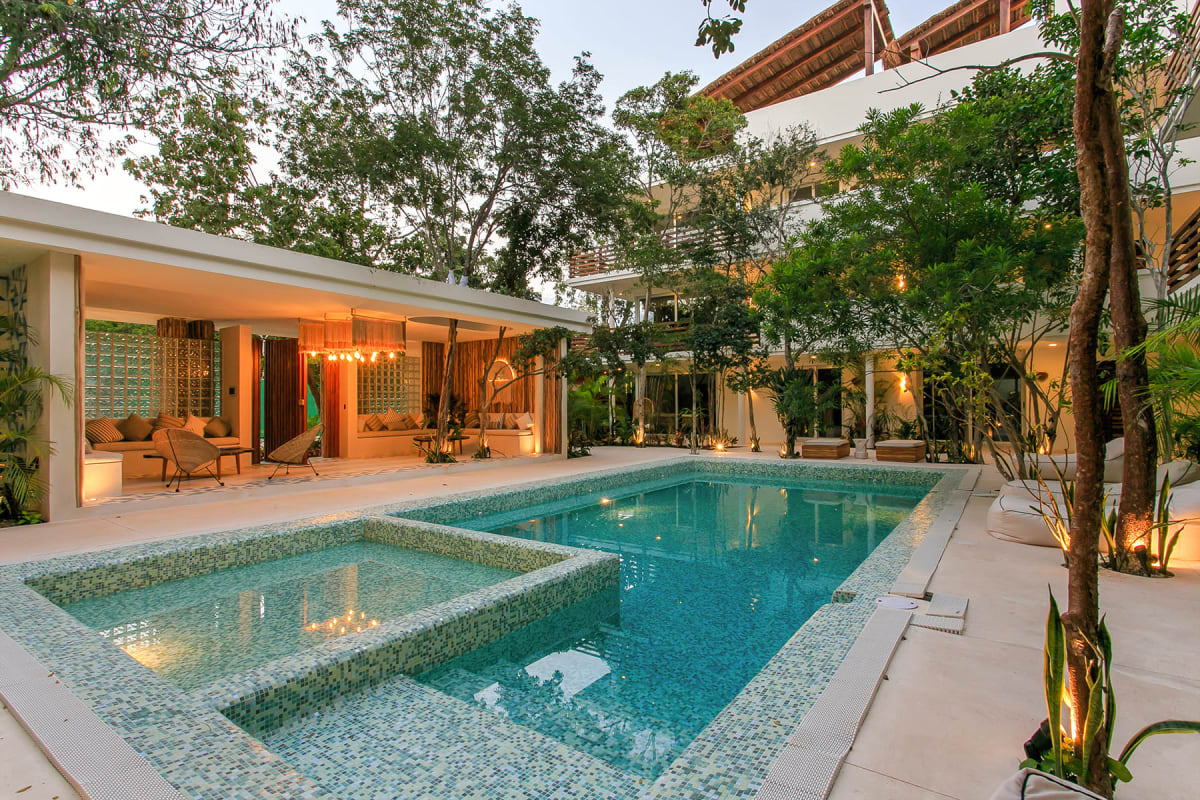v condos for sale in tulum carmela pool and lounge night
