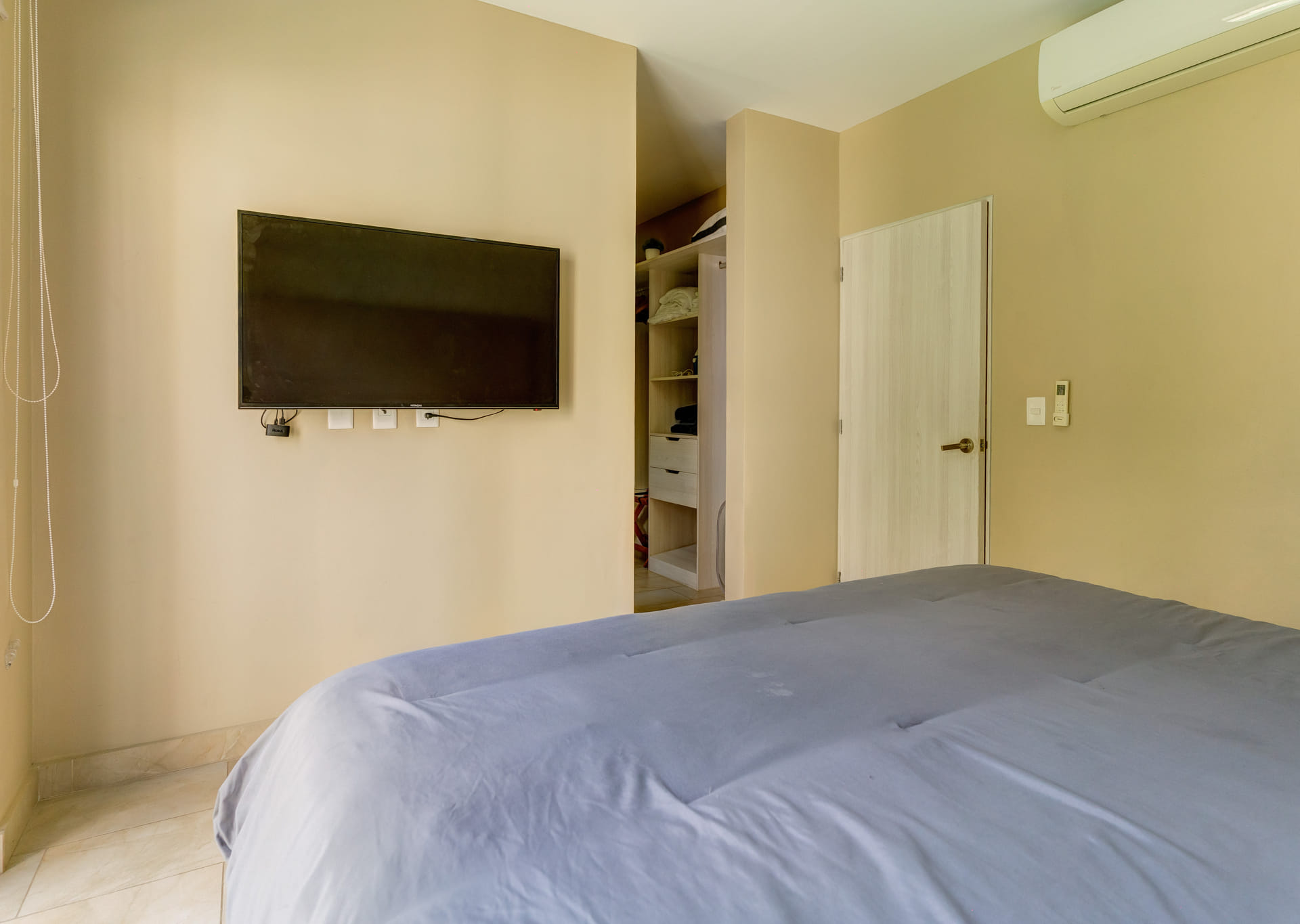 villa for sale in playa del carmen mayakoba master bedroom with tv an closet