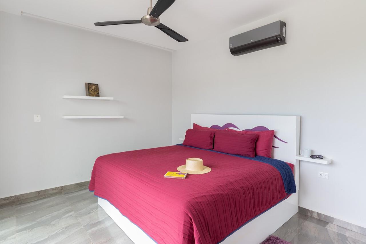 o houses for sale in tulum casa armonia pink bedroom