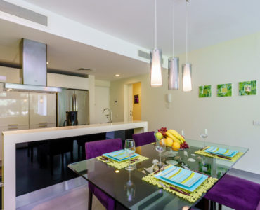 f golf course playa del carmen condos: nick price 2 bedroom kitchen and dining