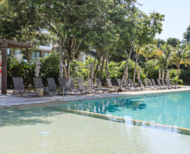 o golf course condos for sale in playa del carmen swimming pool