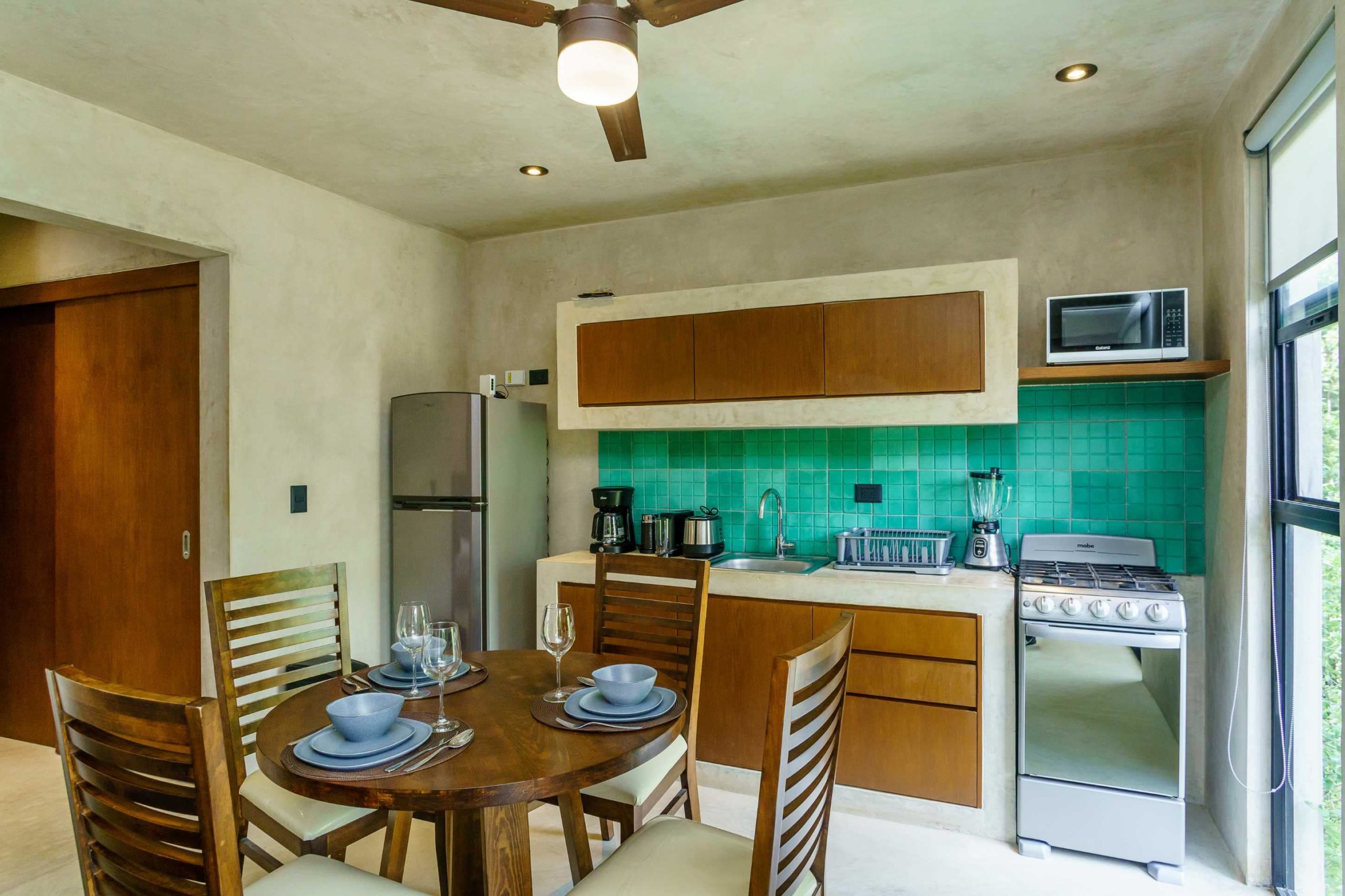 f2 tulum condos sukha penthouse dining area and kitchen