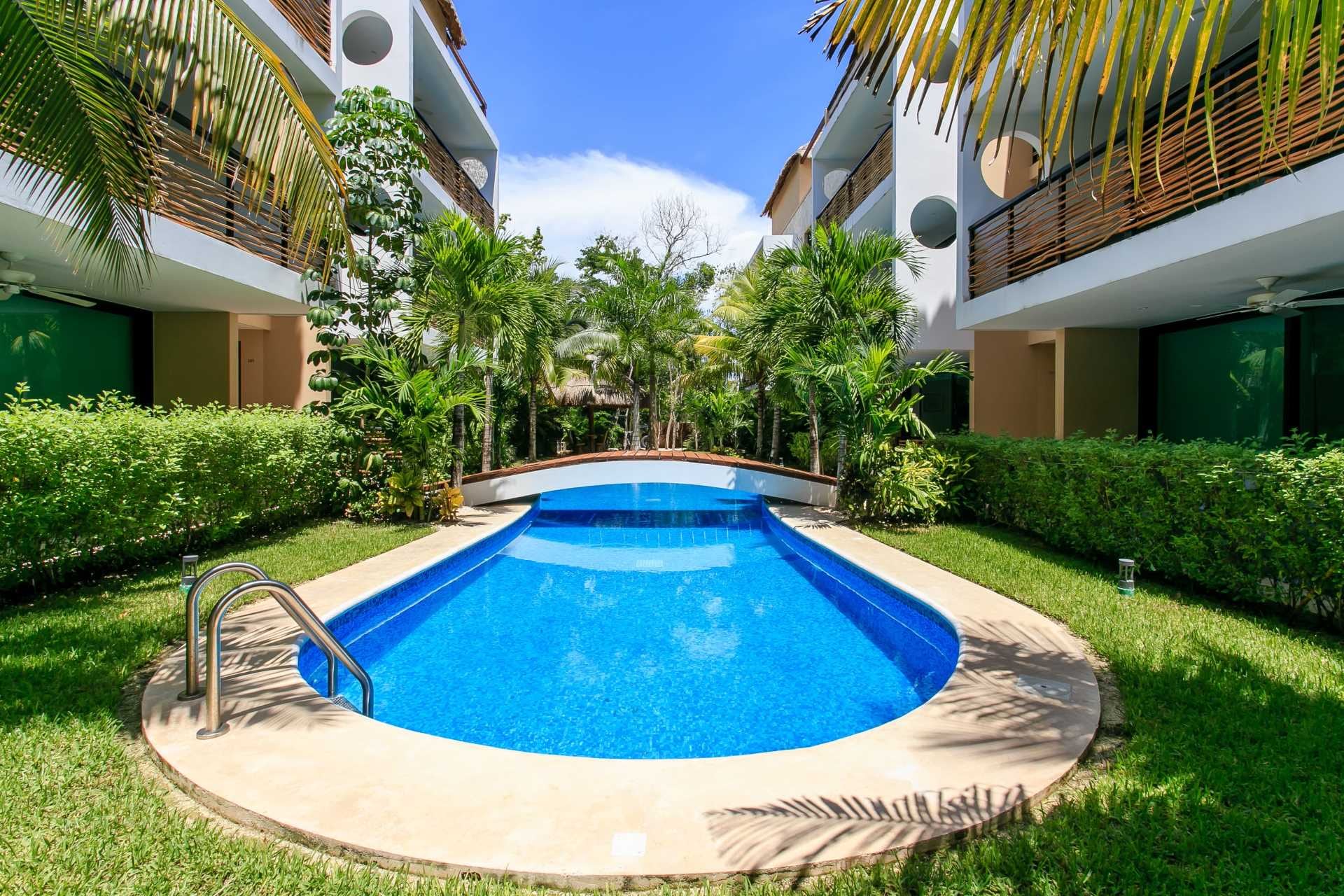 x apartments for sale in tulum encanto garden unit pool and tropical plants