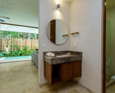 j tulum condos bajo cielo bathroom to living space