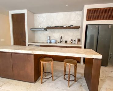 b essentia condos for sale aldea zama rooftop bedroom kitchen bar low