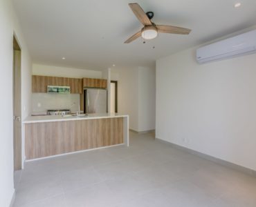 akumal condos for sale zamira penthouse living area & kitchen