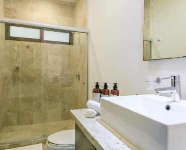 m playacar real estate akoya condo bathroom with shower