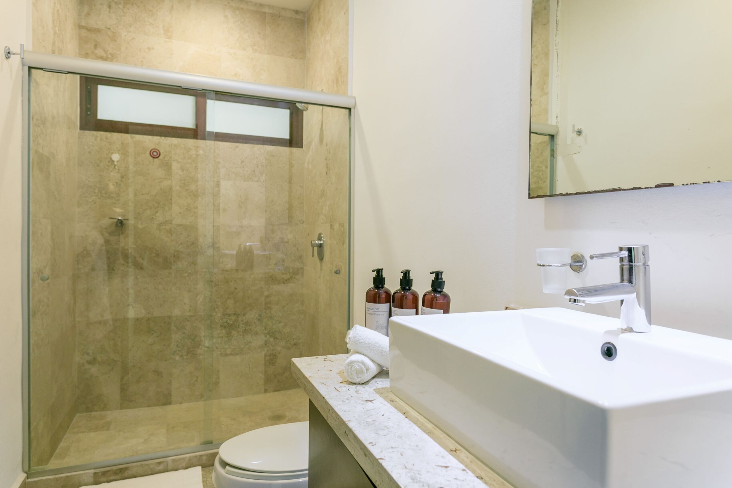 m playacar real estate akoya condo bathroom with shower