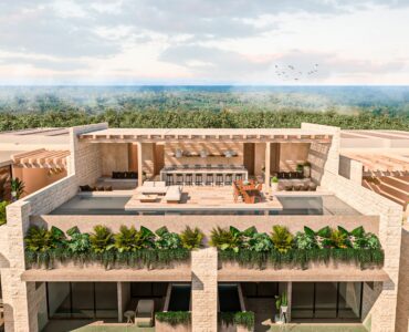 condo for sale in tulum nuup swimming pool with sun beds and jungle