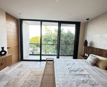 exclusive residences for sale in tulum the enclave bedroom with tv