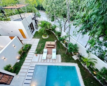 exclusive residences for sale in tulum the enclave pool with garden and plants