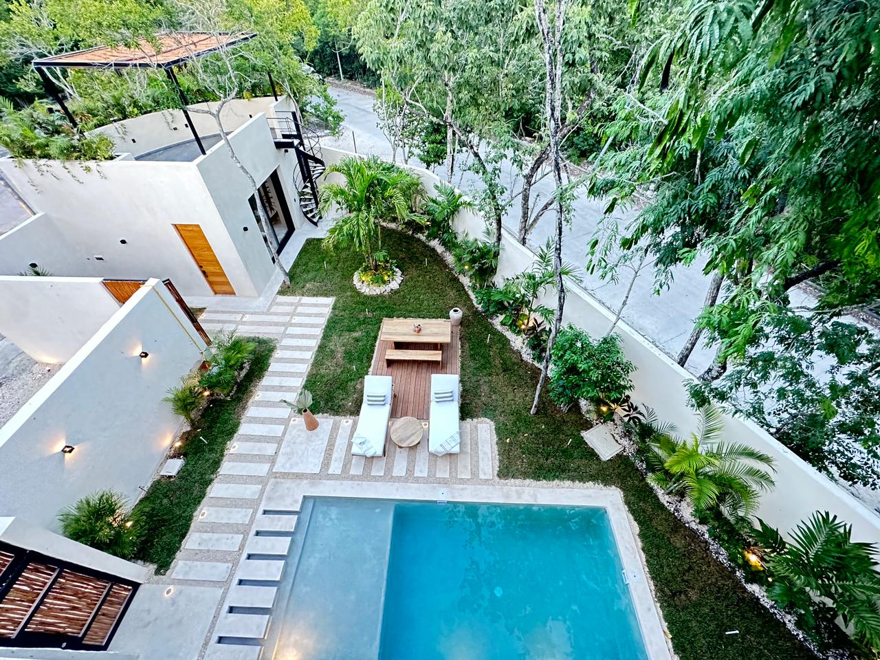 exclusive residences for sale in tulum the enclave pool with garden and plants