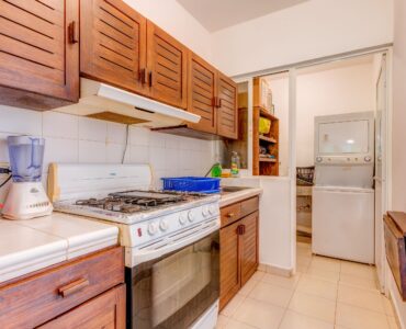 g real estate playacar playa del carmen la concha condo kitchen to laundry room