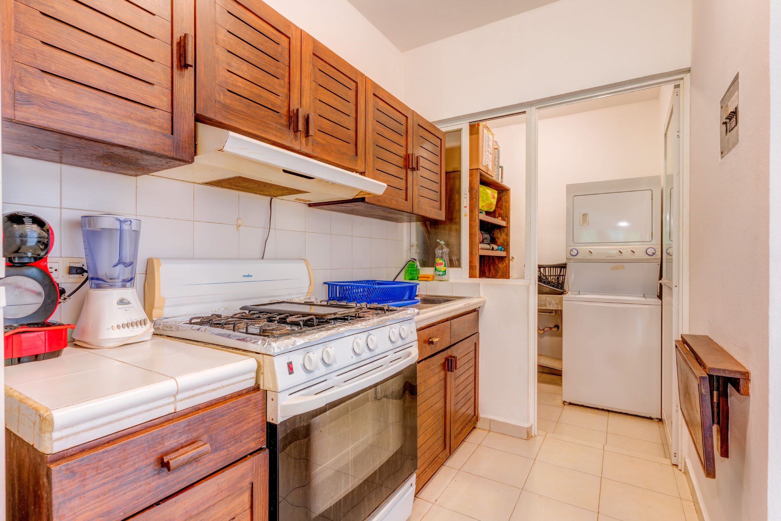 g real estate playacar playa del carmen la concha condo kitchen to laundry room