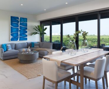 condos for sale in puerto cancun woha living room, dining room and terrace