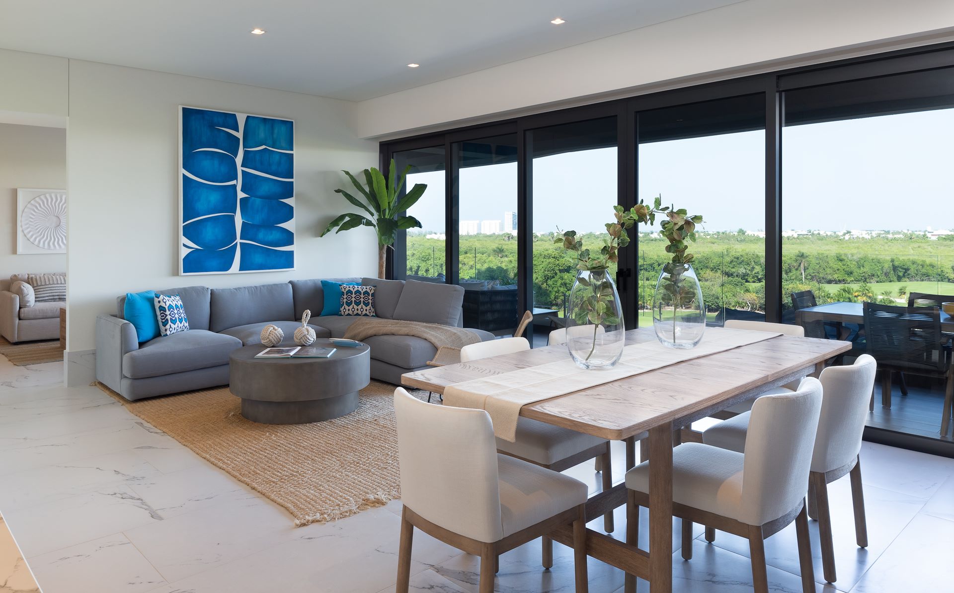 condos for sale in puerto cancun woha living room, dining room and terrace