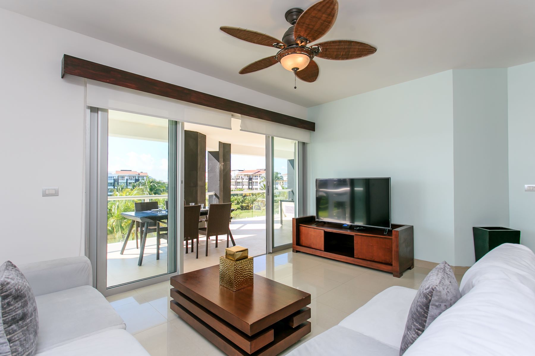 exclusive 2 bedroom condo for sale in mareazul playa del carmen living room with tv