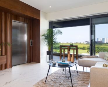 exclusive 2 bedroom condo for sale in puerto cancun woha living room with elevator and terrace