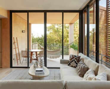 playa del carmen condos in corasol the village living room with big windows and terrace