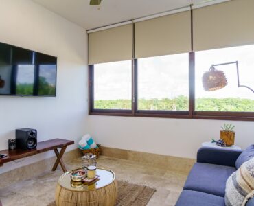 one bedroom ph in omara boca zama aldea zama with private rooftop and jacuzzi living room with sofa and tv room