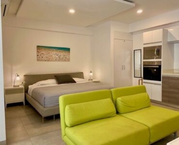 studio at playa del carmen icono 303 bed and sofa