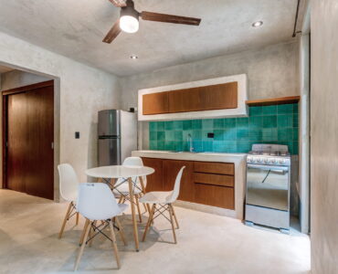 one bedroom ground floor condo tulum real estate sukha112 la veleta kitchen and table cocina y mesa