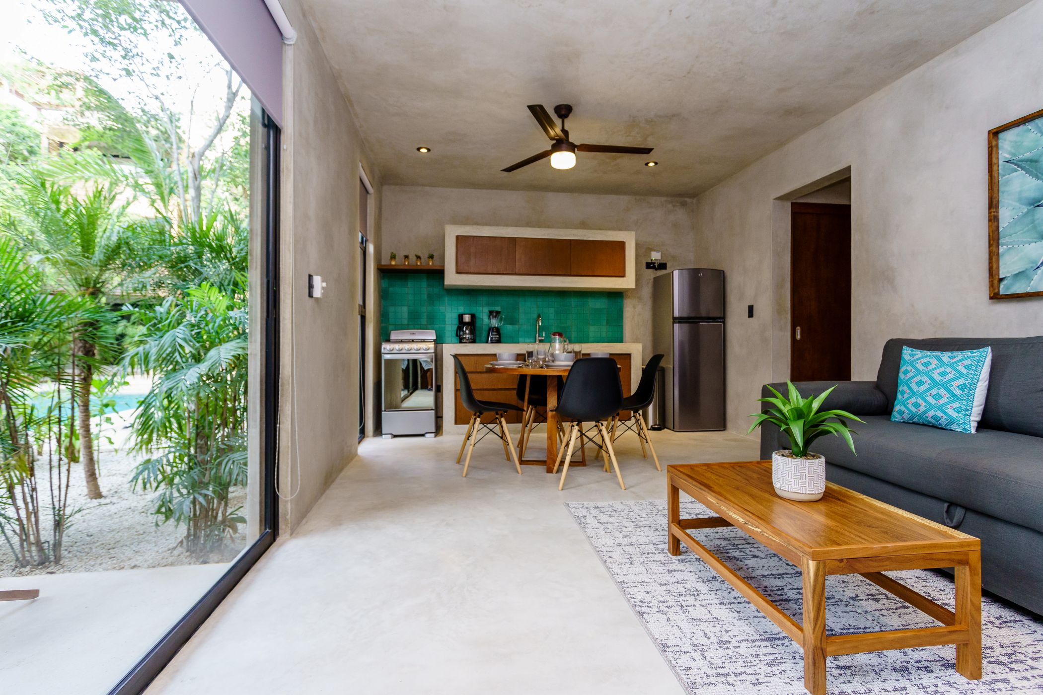 sukha 101 condo one bedroom la veleta tulum moskito real estate living and dining room with terrace
