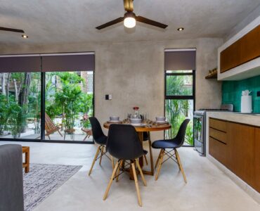 sukha 101 condo one bedroom la veleta tulum moskito real estate table and kitchen