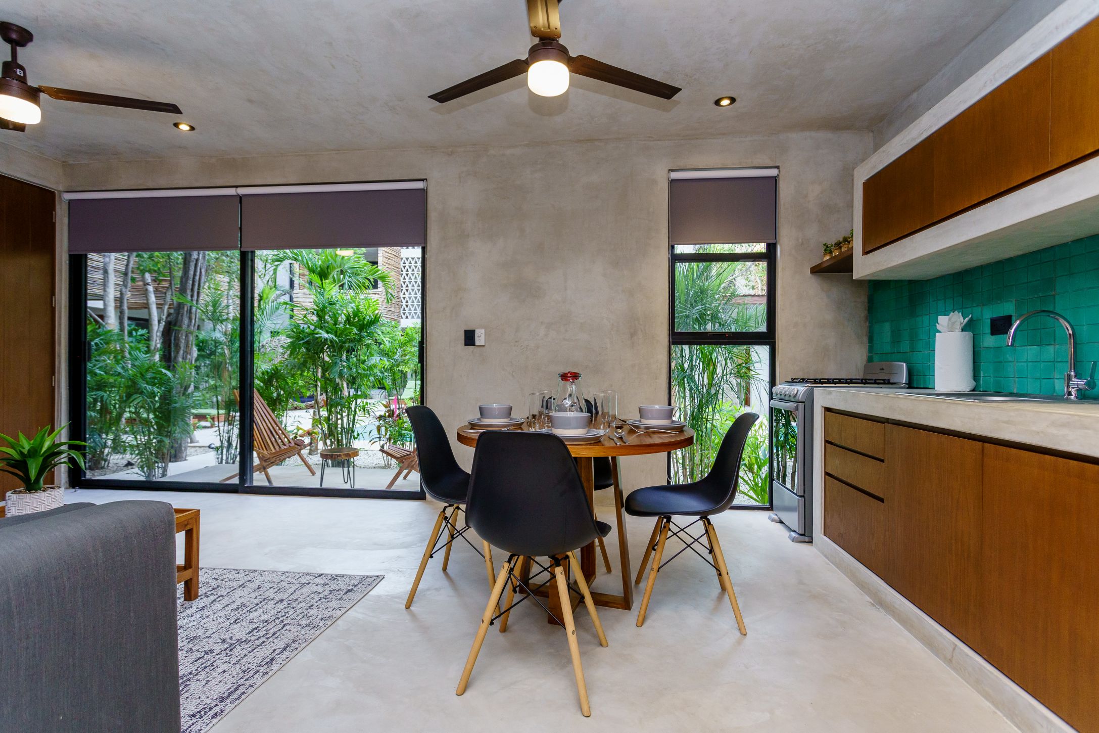 sukha 101 condo one bedroom la veleta tulum moskito real estate table and kitchen