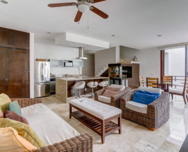 c playacar condos for sale akoya living room to kitchen