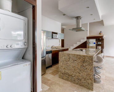 f playacar condos for sale akoya laundry room