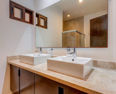 playacar condos for sale akoya bathroom with mirror