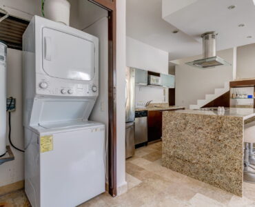 playacar condos for sale akoya laundry area