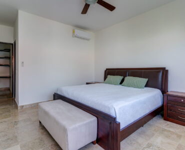 playacar condos for sale akoya master bedroom with linen