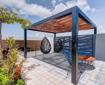two bedroom condo riva playa del carmen suspended chairs in lounge area