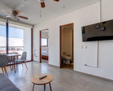 playa del carmen condos for sale 2 bedroom condo tzalam living room area with tv
