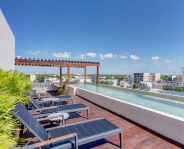 playa del carmen condos for sale 2 bedroom condo tzalam rooftop swimming pool with sun beds