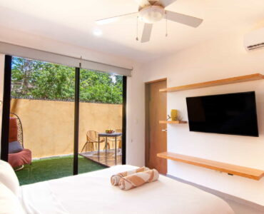 two bedroom ground floor condo in playa del carmen lunada master bedroom with tv